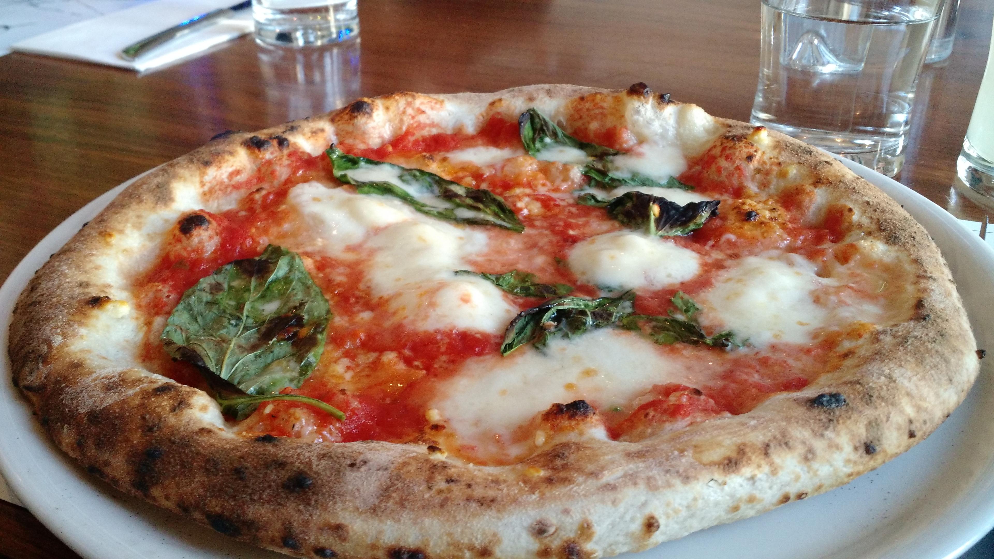A close-up of a margherita pizza.