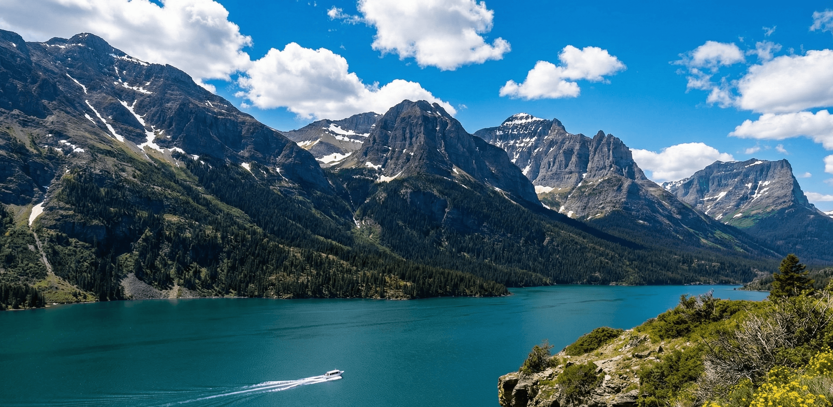 Saint Mary Lake in Glacier National Park, on a bright, clear day.