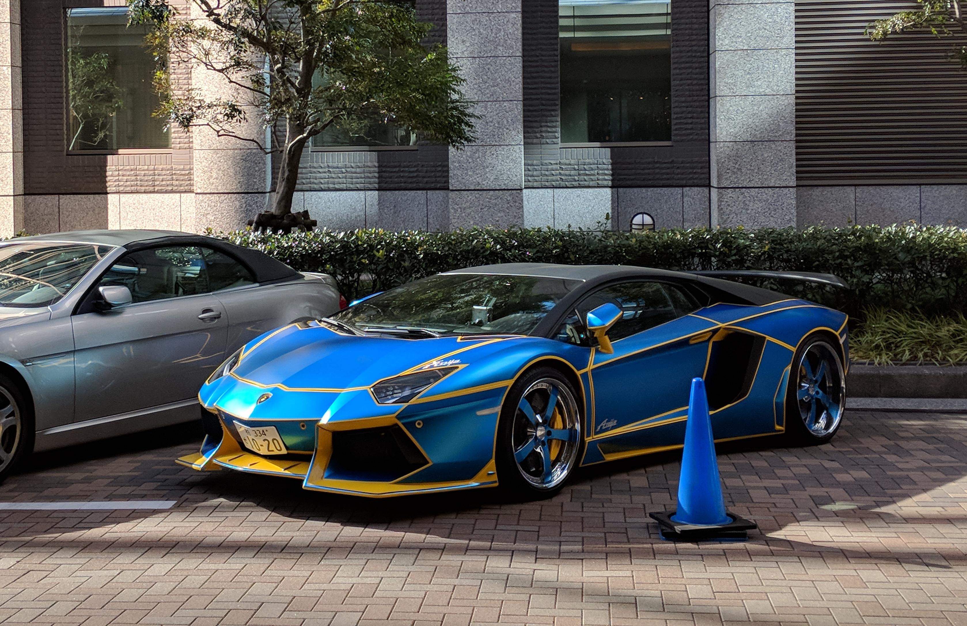 A bright blue parked Lamborghini.