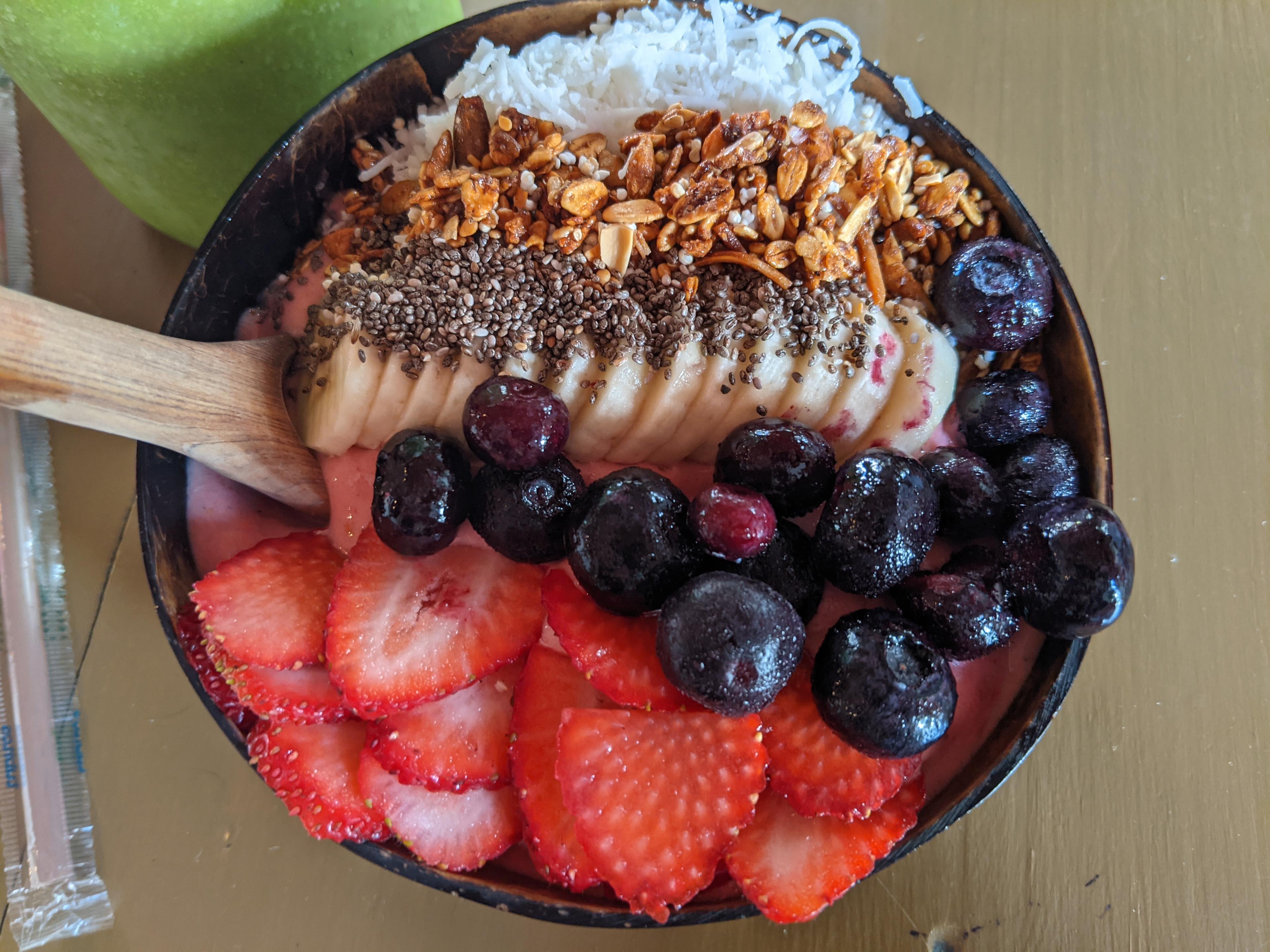 An overhead view of a bowl of fruit.